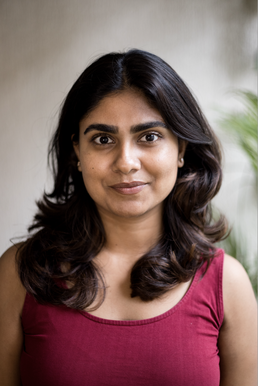 headshot of Shilpa Raju in a red top